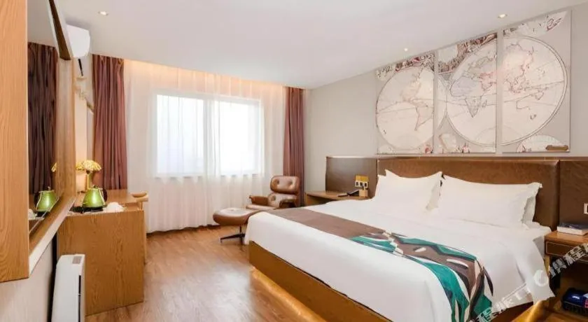 Bed in James Joyce Coffetel Xinyang Xixian Longhu Huayi