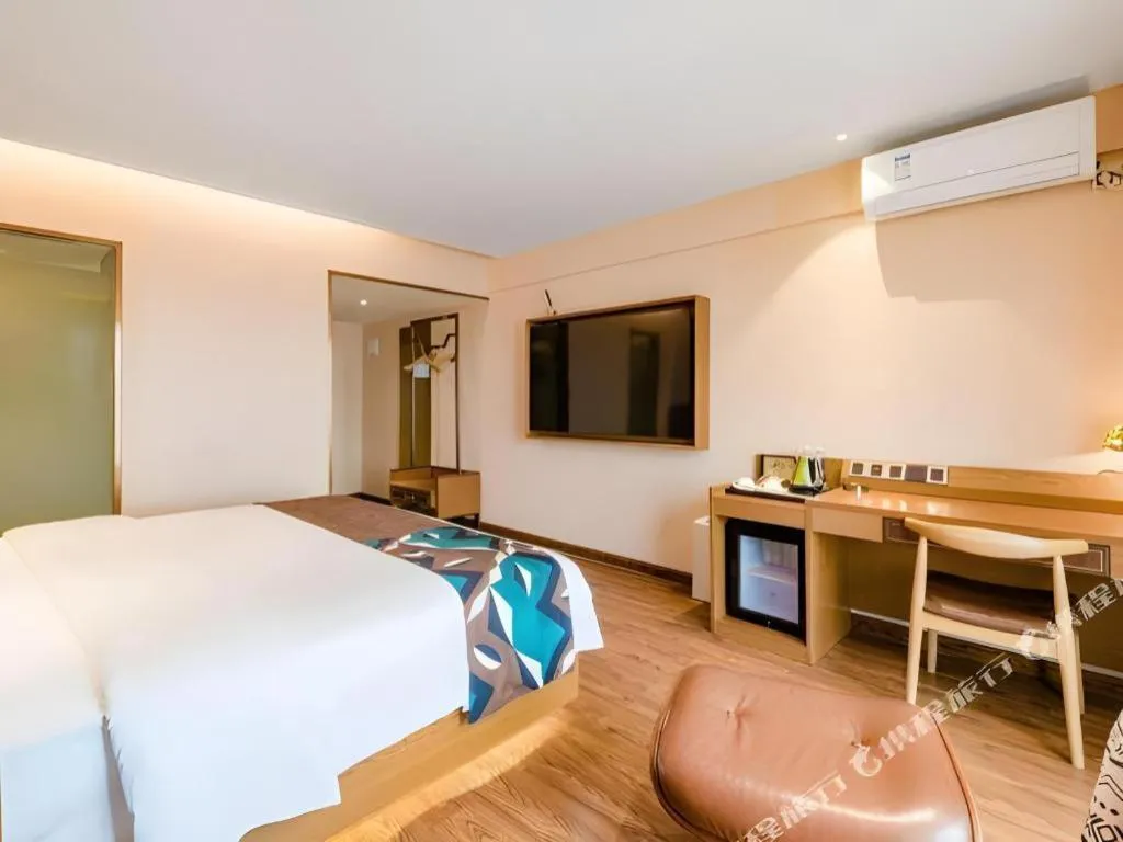 Bed in James Joyce Coffetel Xinyang Xixian Longhu Huayi