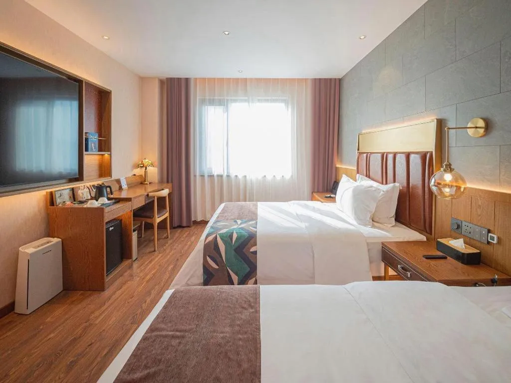 Bed in James Joyce Coffetel Xinyang Xixian Longhu Huayi