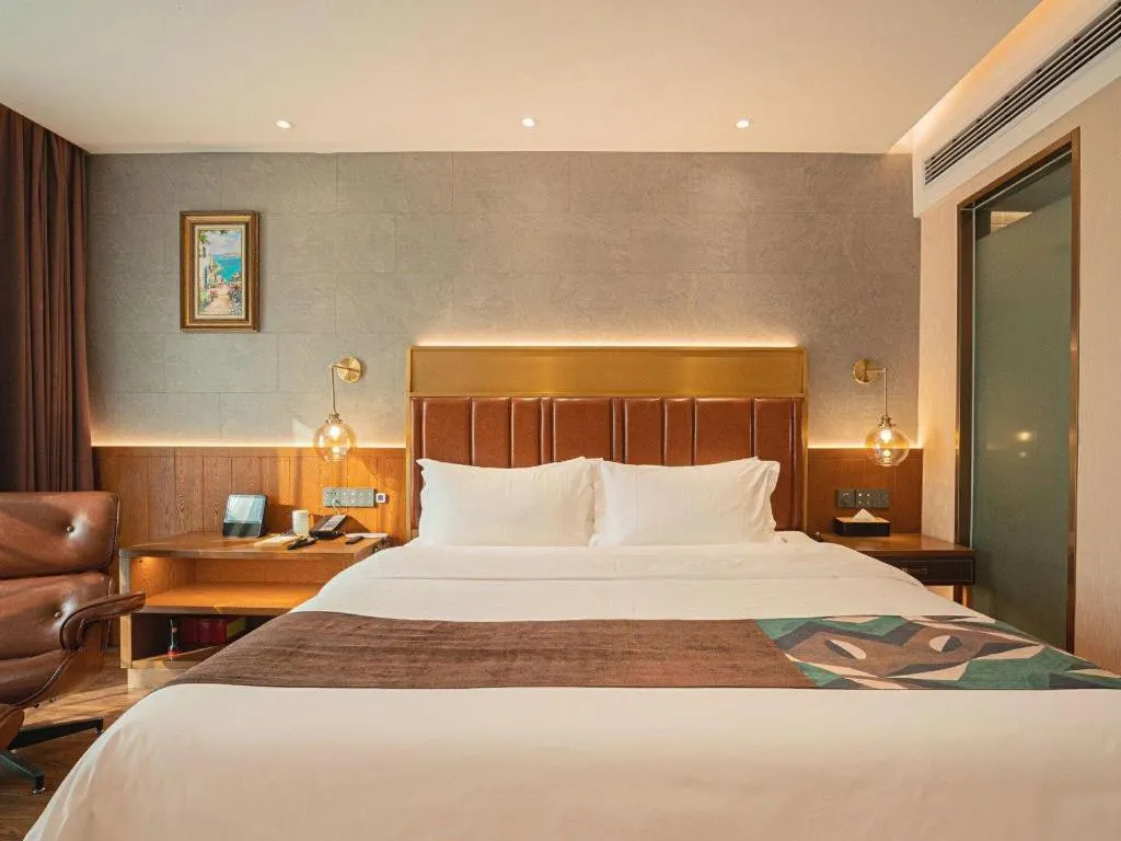 Bed in James Joyce Coffetel Xinyang Xixian Longhu Huayi