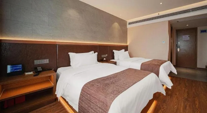 Bed in James Joyce Coffetel Xinyang Xixian Longhu Huayi