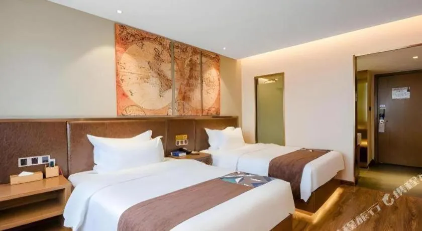 Bed in James Joyce Coffetel Xinyang Xixian Longhu Huayi