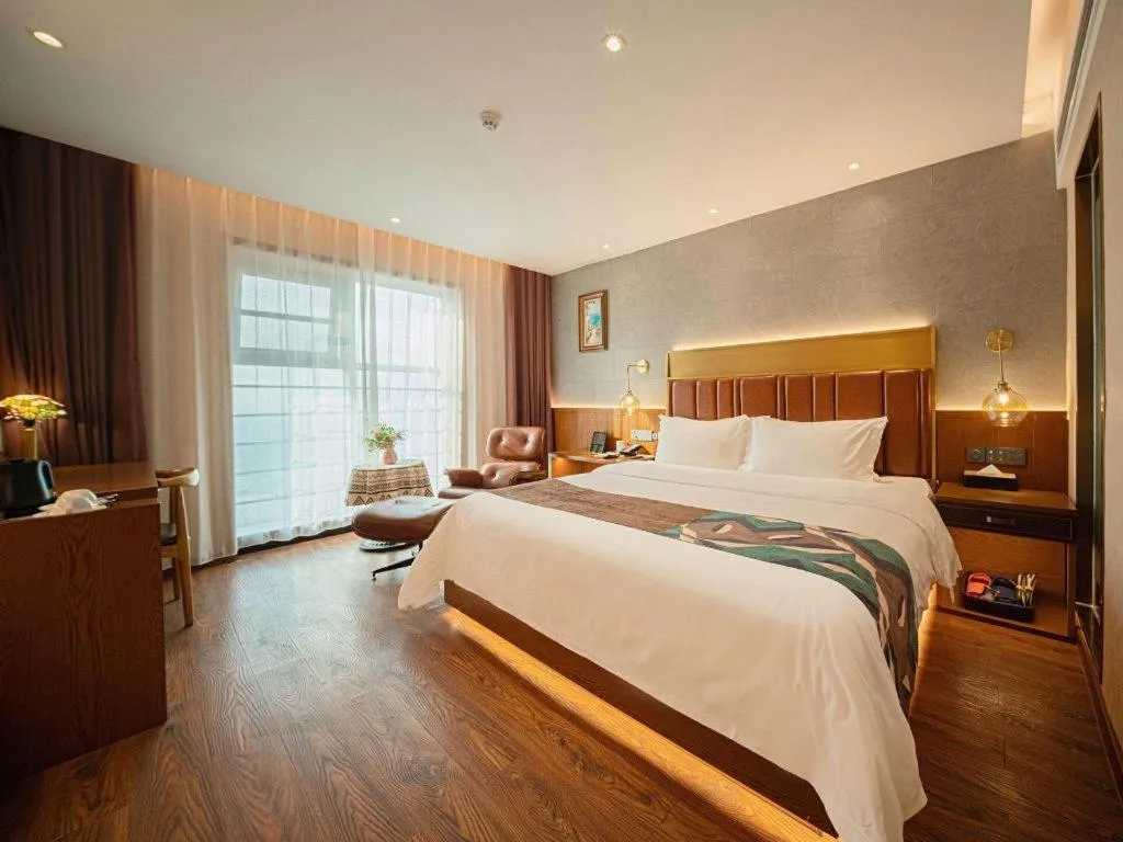 Bed in James Joyce Coffetel Xinyang Xixian Longhu Huayi