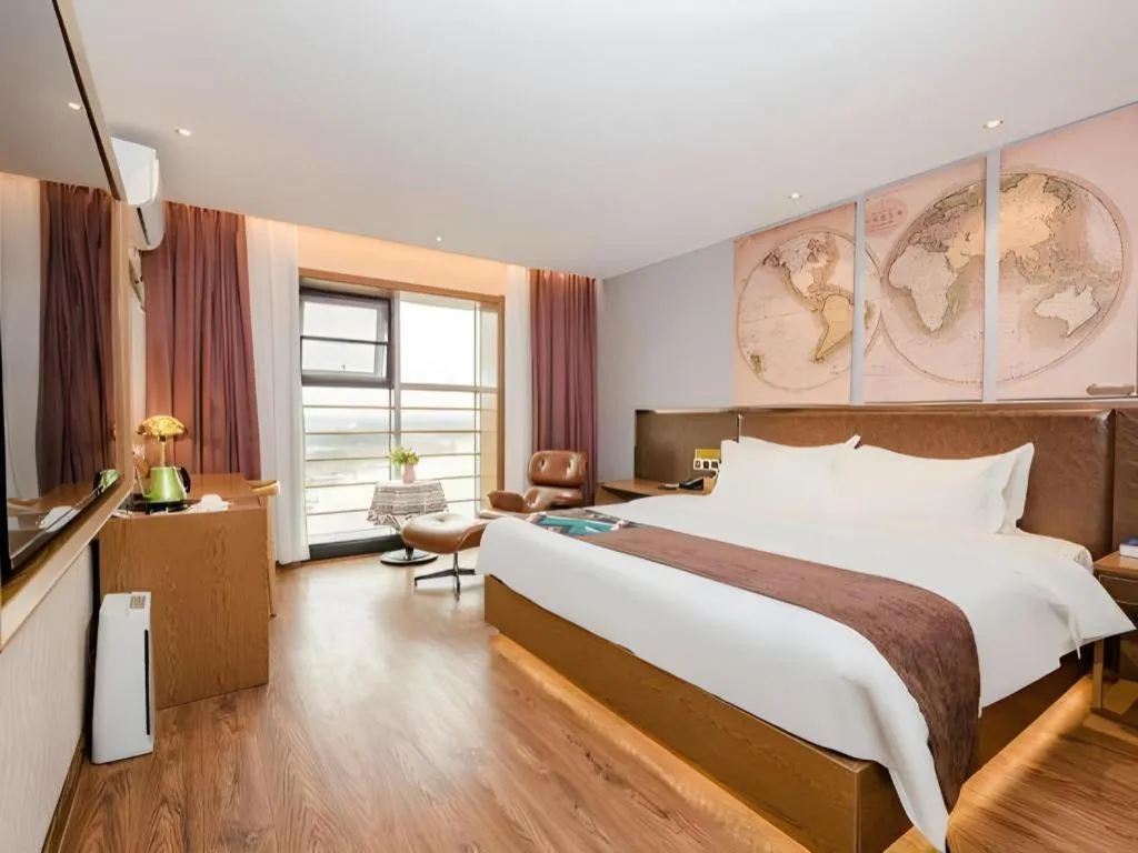 Bed in James Joyce Coffetel Xinyang Xixian Longhu Huayi