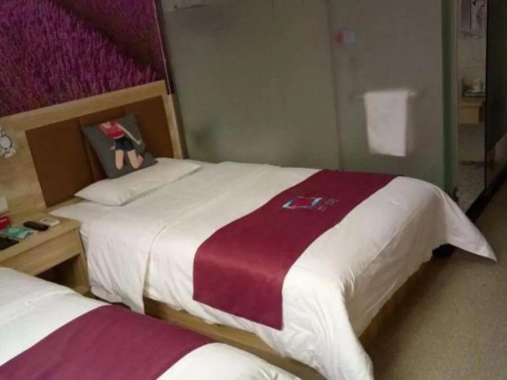 Bed in PAI Hotel Beijing Capital International Airport Linhe Development Zone