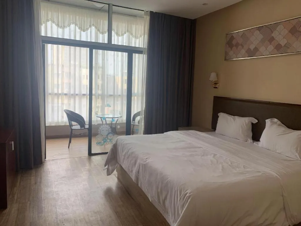 Bed in PAI Hotel Guangzhou North Gate of Chimelong Zoo