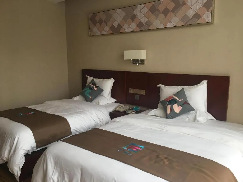 Bed in PAI Hotel Guangzhou North Gate of Chimelong Zoo