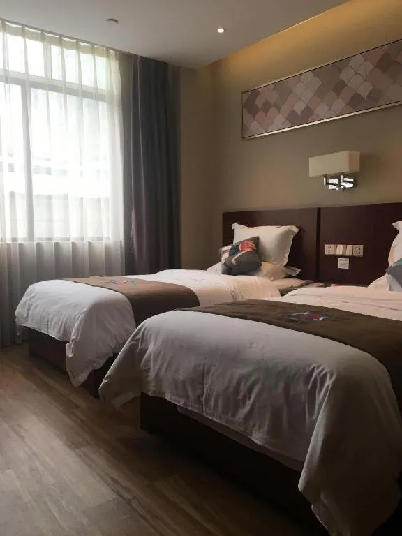 Bed in PAI Hotel Guangzhou North Gate of Chimelong Zoo