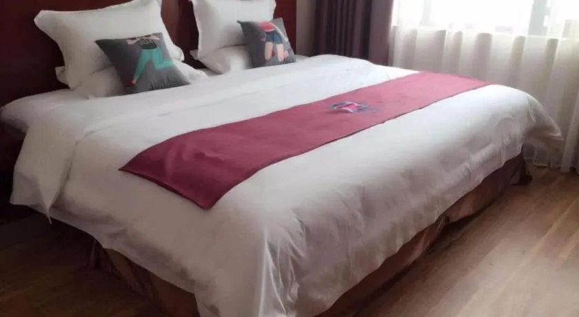 Bed in PAI Hotel Guangzhou North Gate of Chimelong Zoo