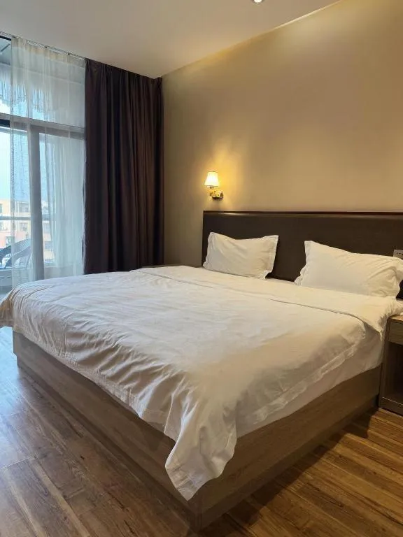Bed in PAI Hotel Guangzhou North Gate of Chimelong Zoo