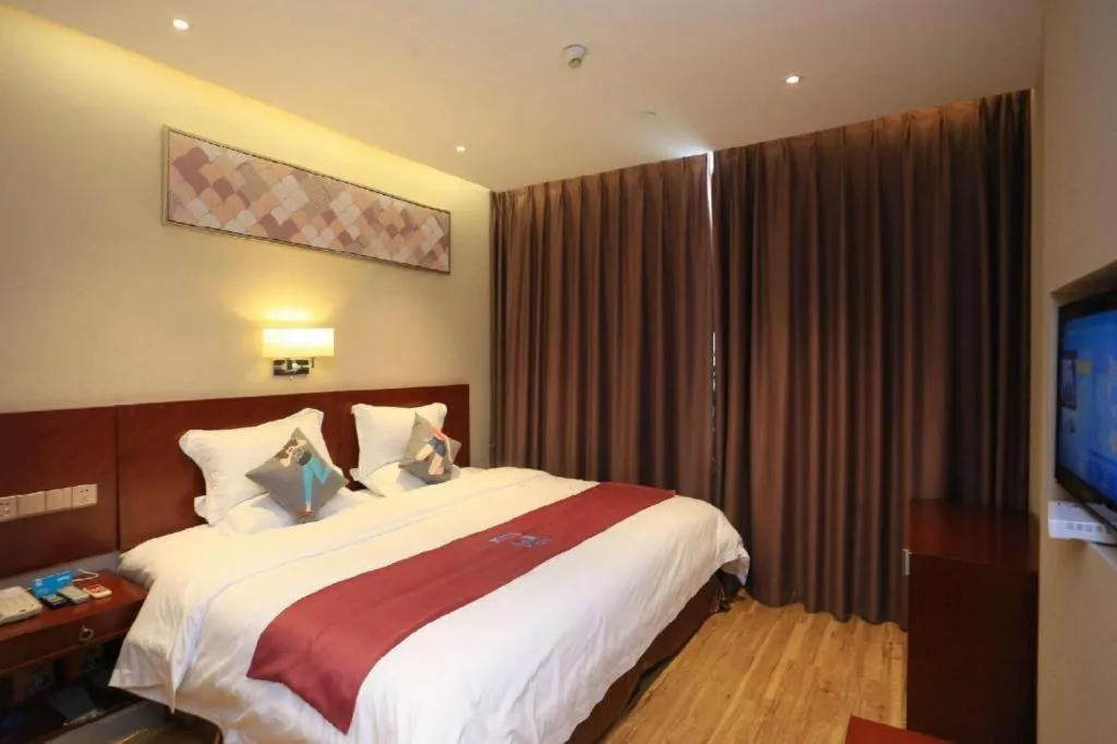 Bed in PAI Hotel Guangzhou North Gate of Chimelong Zoo