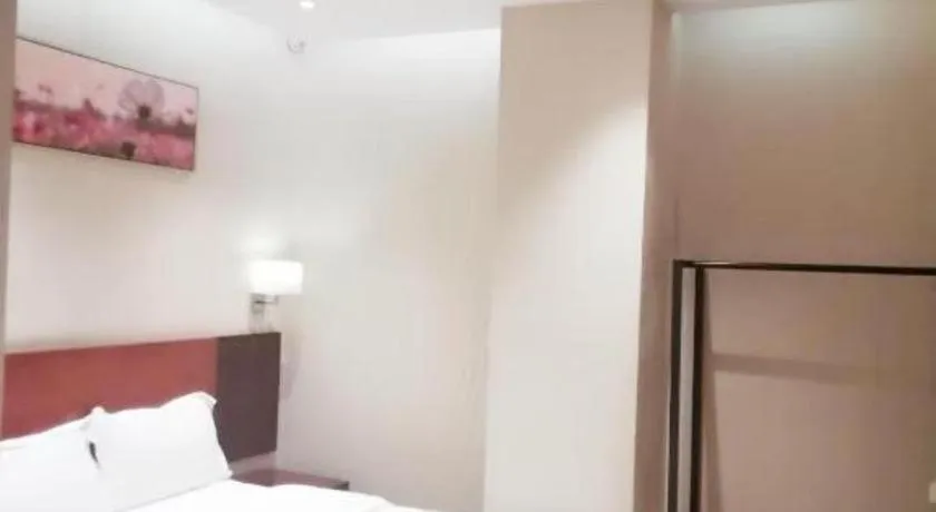 Bed in PAI Hotel Guangzhou North Gate of Chimelong Zoo