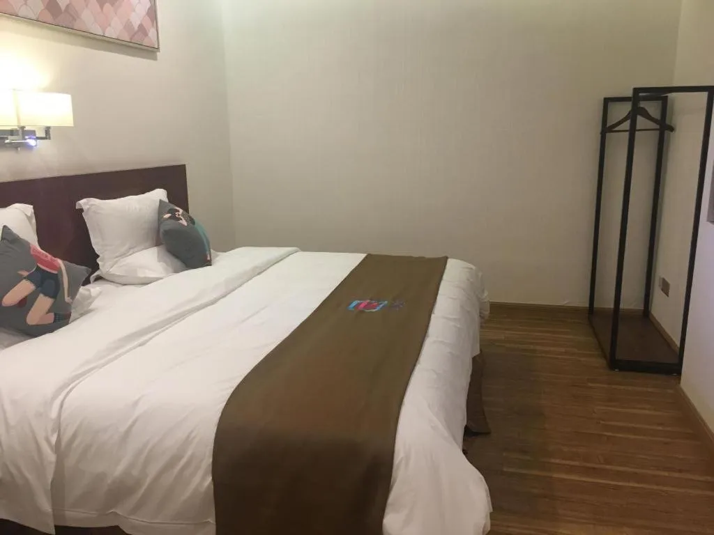 Bed in PAI Hotel Guangzhou North Gate of Chimelong Zoo