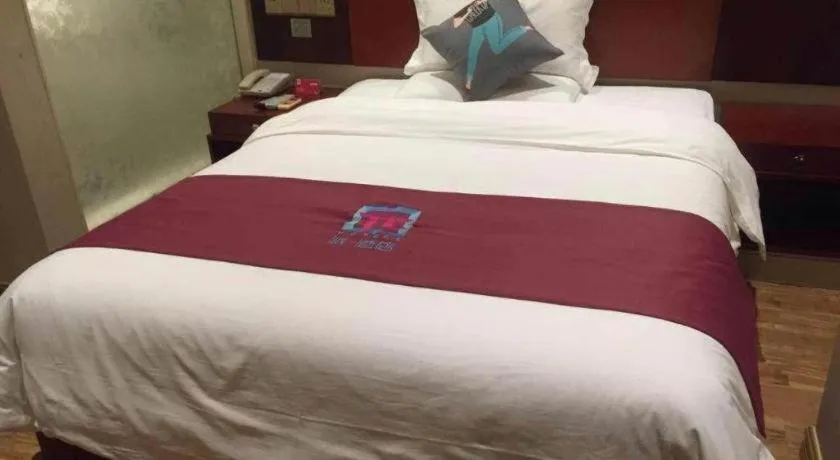 Bed in PAI Hotel Guangzhou North Gate of Chimelong Zoo