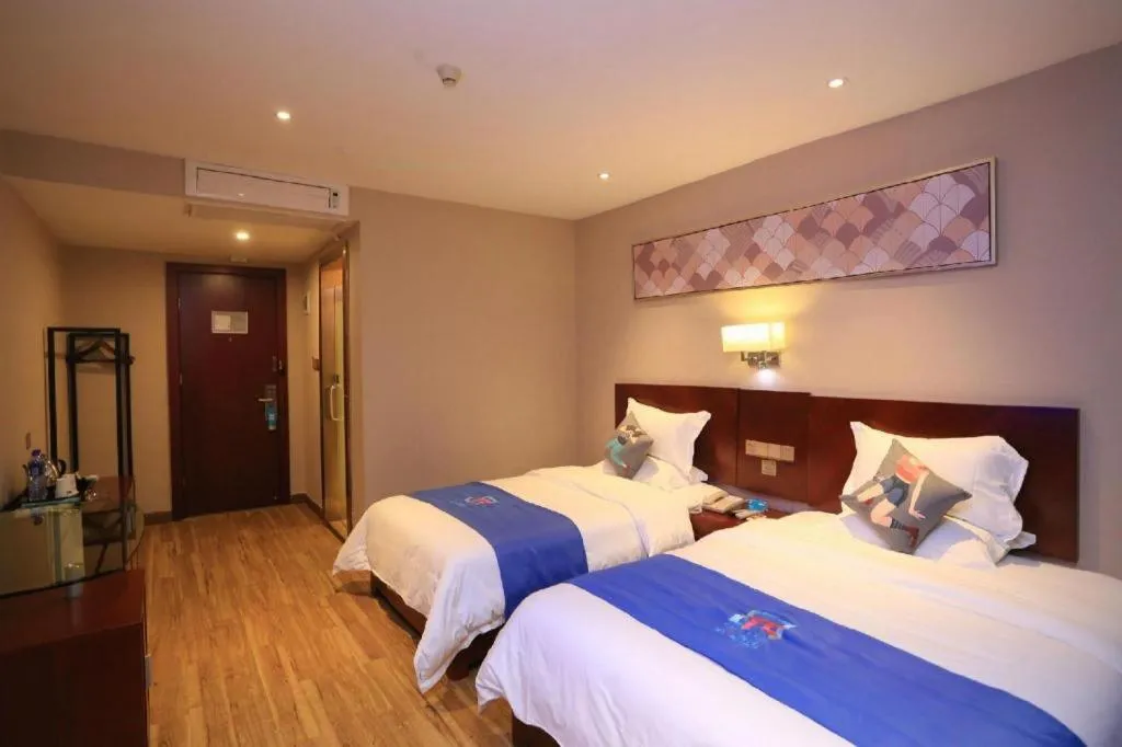 Bed in PAI Hotel Guangzhou North Gate of Chimelong Zoo