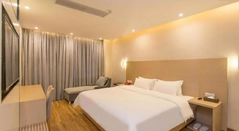 Bed in PAI Hotel Guangzhou North Gate of Chimelong Zoo