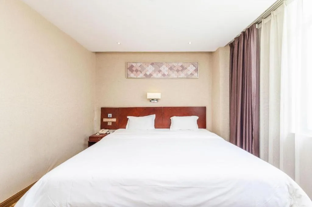 Bed in PAI Hotel Guangzhou North Gate of Chimelong Zoo