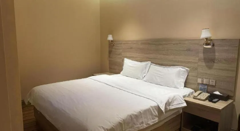 Bed in PAI Hotel Guangzhou North Gate of Chimelong Zoo