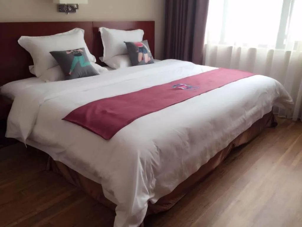 Bed in PAI Hotel Guangzhou North Gate of Chimelong Zoo