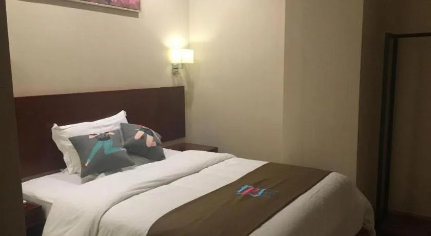 Bed in PAI Hotel Guangzhou North Gate of Chimelong Zoo