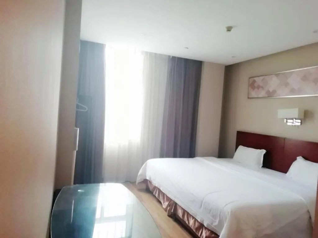 Bed in PAI Hotel Guangzhou North Gate of Chimelong Zoo