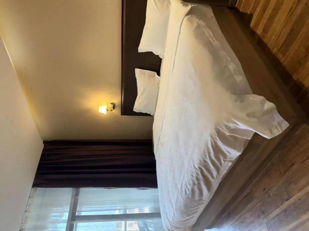 Bed in PAI Hotel Guangzhou North Gate of Chimelong Zoo