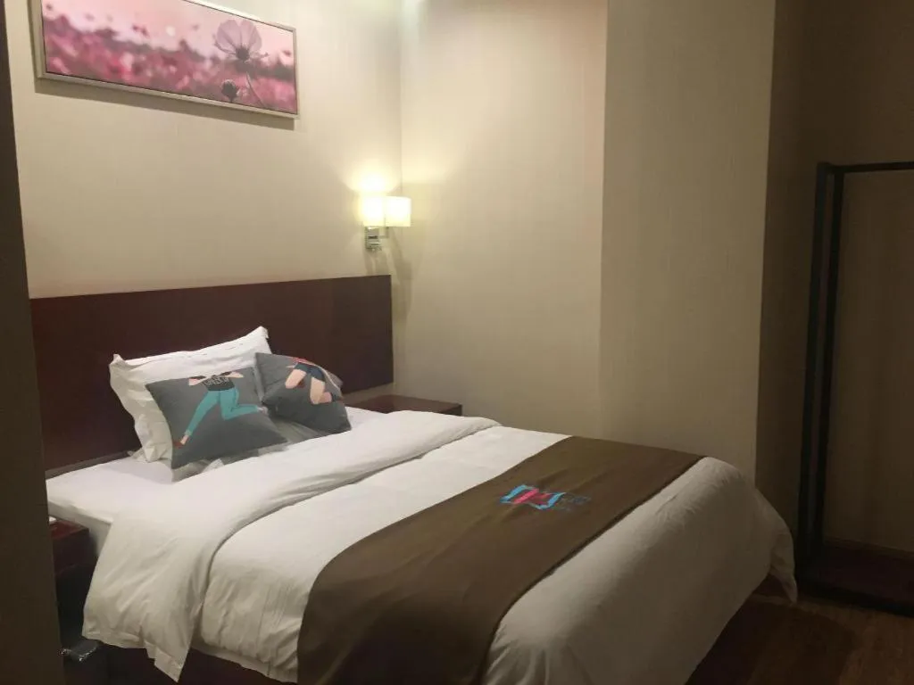 Bed in PAI Hotel Guangzhou North Gate of Chimelong Zoo