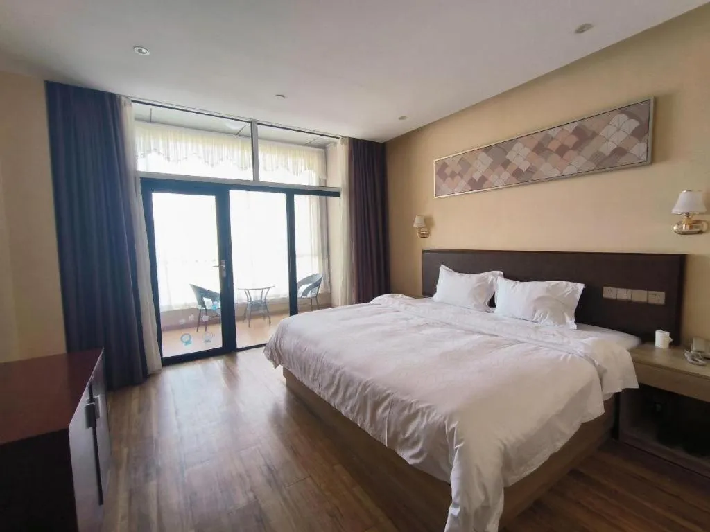 Bed in PAI Hotel Guangzhou North Gate of Chimelong Zoo