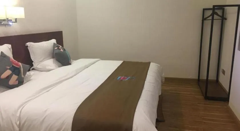 Bed in PAI Hotel Guangzhou North Gate of Chimelong Zoo