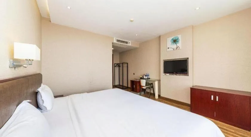 Bed in PAI Hotel Guangzhou North Gate of Chimelong Zoo