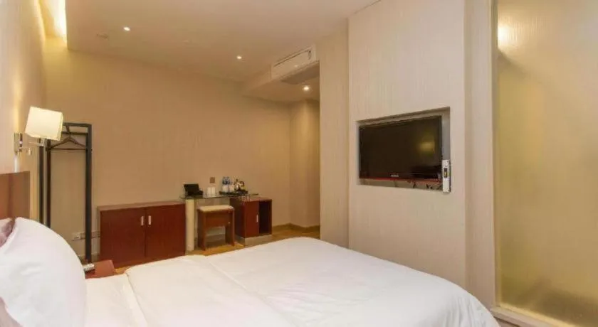 Bed in PAI Hotel Guangzhou North Gate of Chimelong Zoo