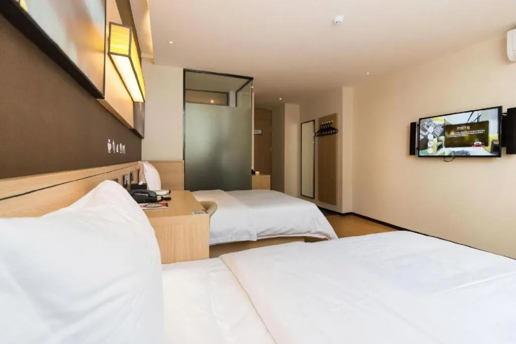 Bed in IU Hotels Guangzhou Panyu Dashi Chimelong Safari Park