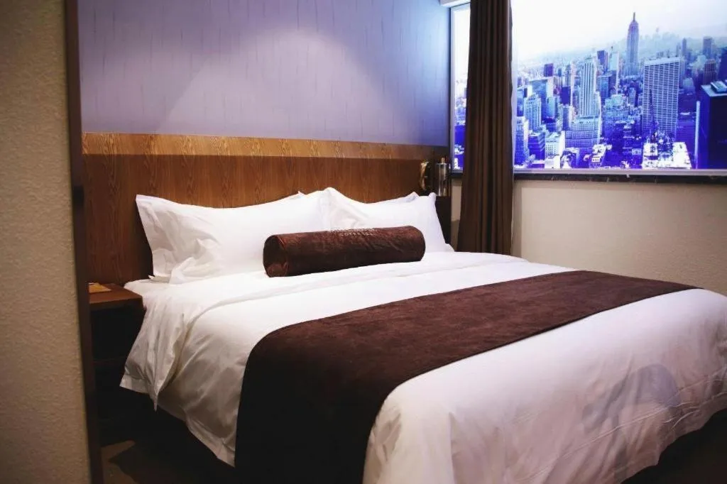 Bed in James Joyce Coffetel Shijiazhuang Century Park Shiji Huamao
