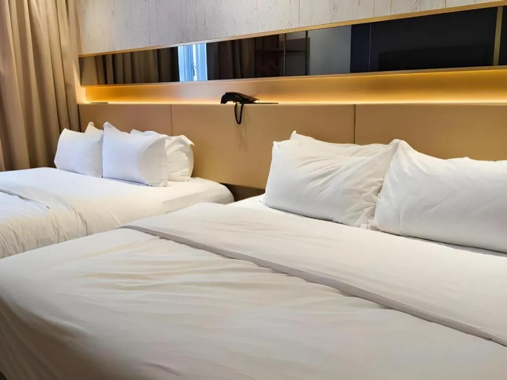 Bed in Grand City Hotel