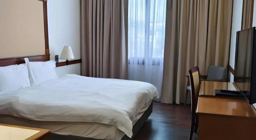 Bed in Grand City Hotel