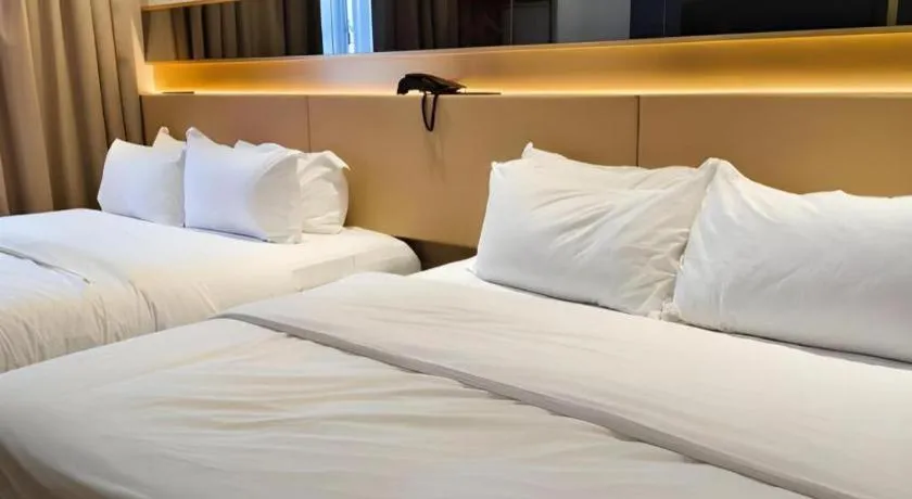 Bed in Grand City Hotel