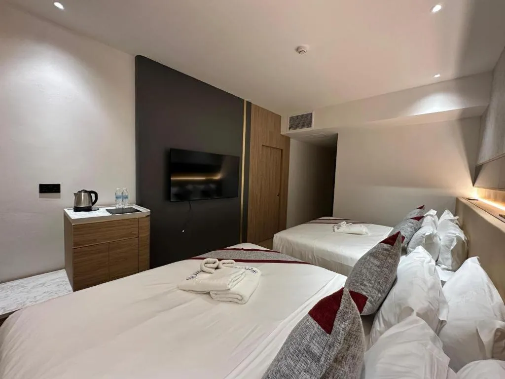 Bed in Grand City Hotel