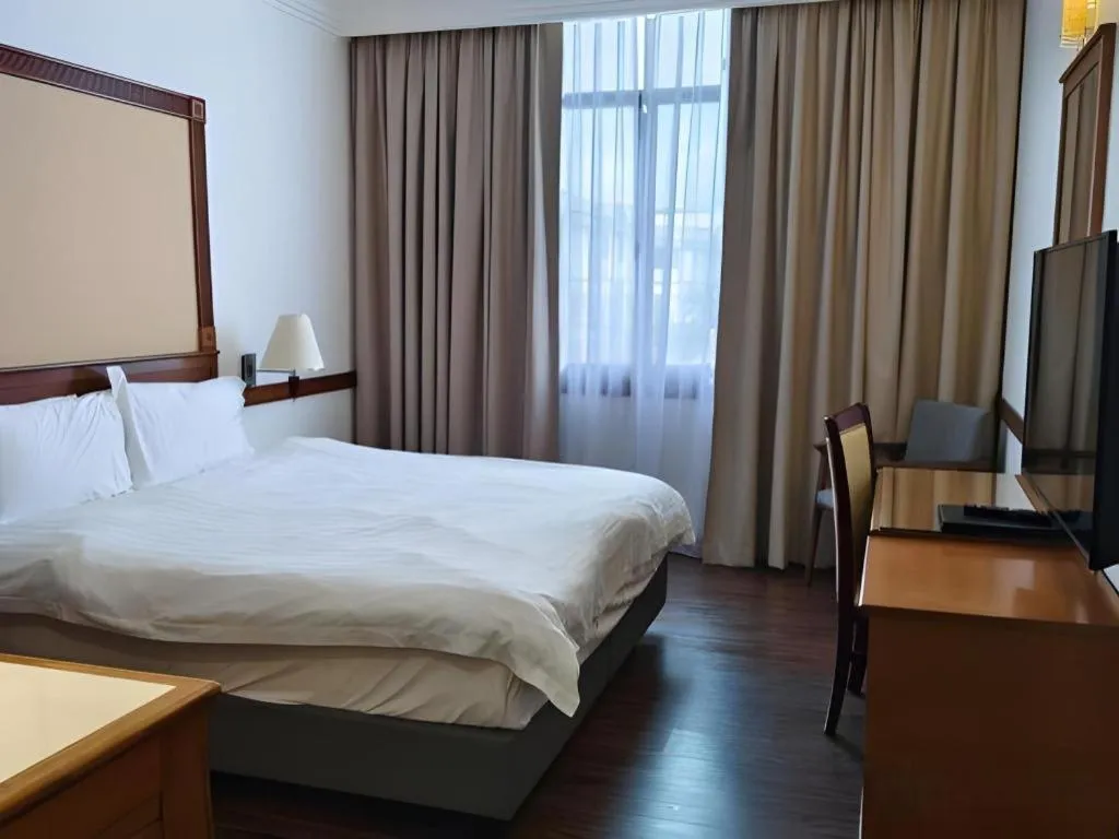 Bed in Grand City Hotel