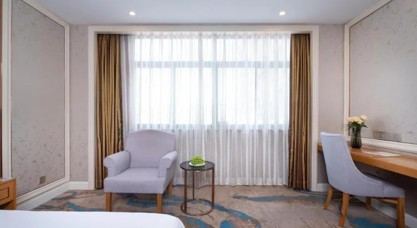 Bed in Vienna Hotel Hangzhou Fuyang In-Time