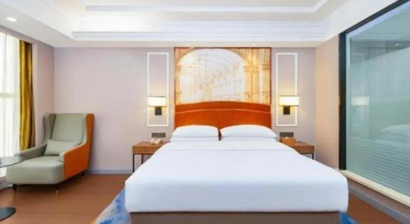 Bed in Vienna International Hotel Kunming Guangfu Road Aegean Shopping Center
