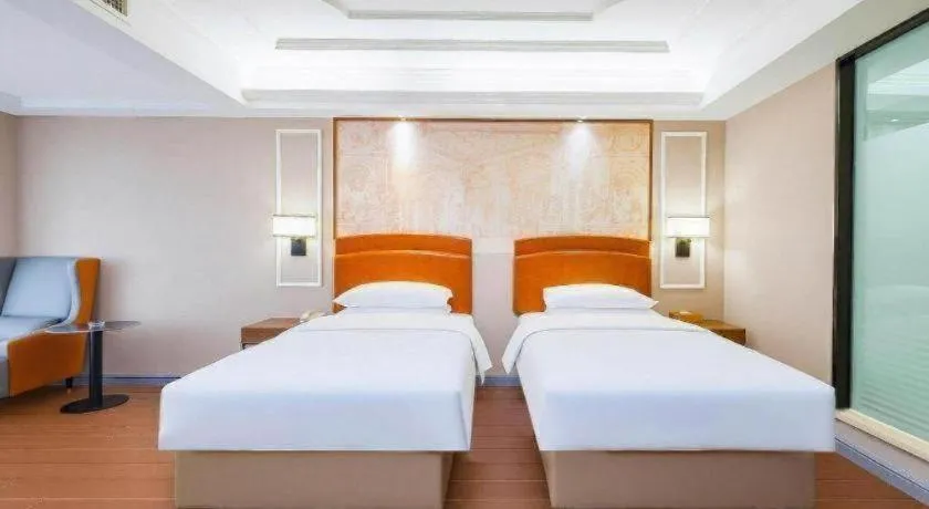 Bed in Vienna International Hotel Kunming Guangfu Road Aegean Shopping Center
