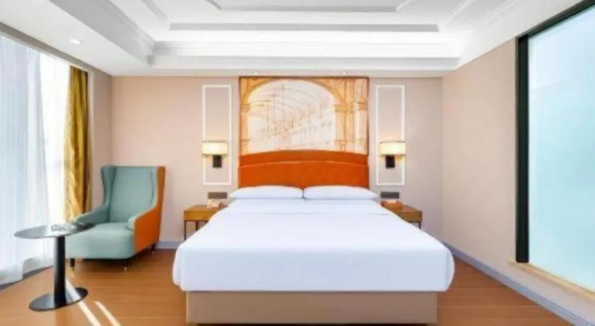 Bed in Vienna International Hotel Kunming Guangfu Road Aegean Shopping Center