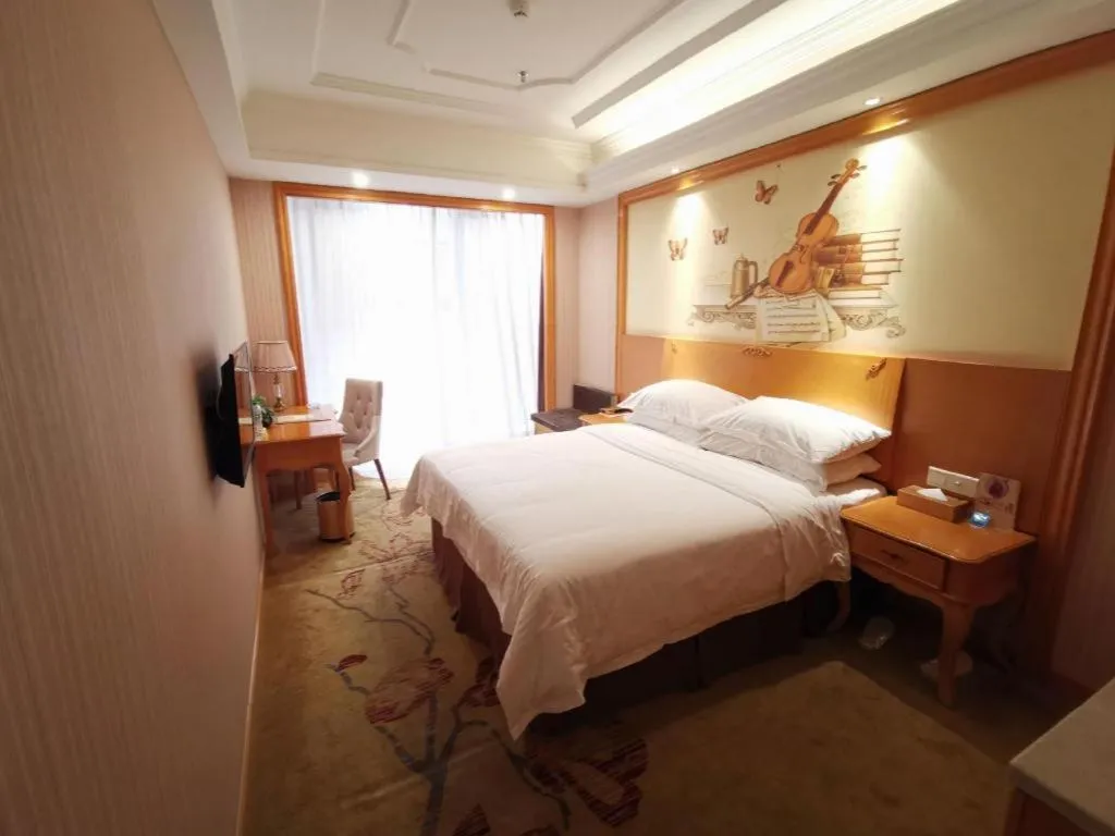 Bed in Vienna International Hotel Kunming Guangfu Road Aegean Shopping Center