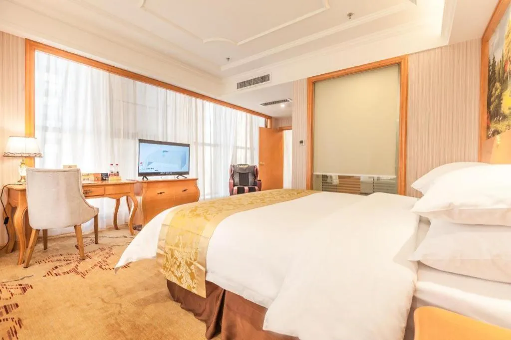 Bed in Vienna International Hotel Kunming Guangfu Road Aegean Shopping Center