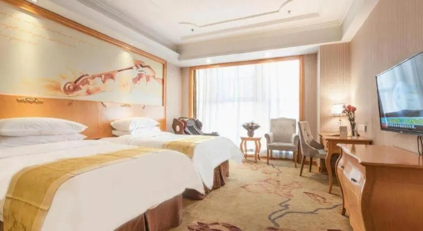 Bed in Vienna International Hotel Kunming Guangfu Road Aegean Shopping Center