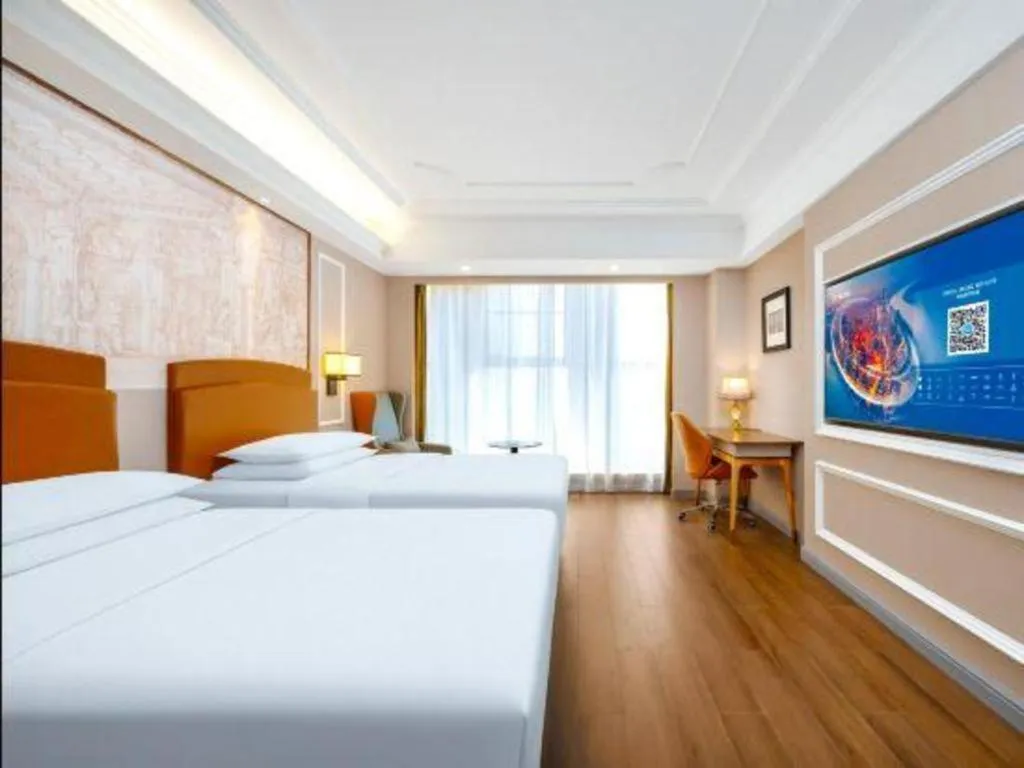 Bed in Vienna International Hotel Kunming Guangfu Road Aegean Shopping Center