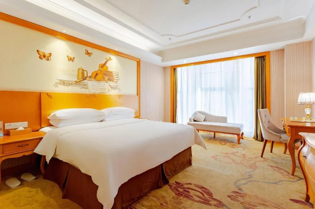 Bed in Vienna International Hotel Kunming Guangfu Road Aegean Shopping Center