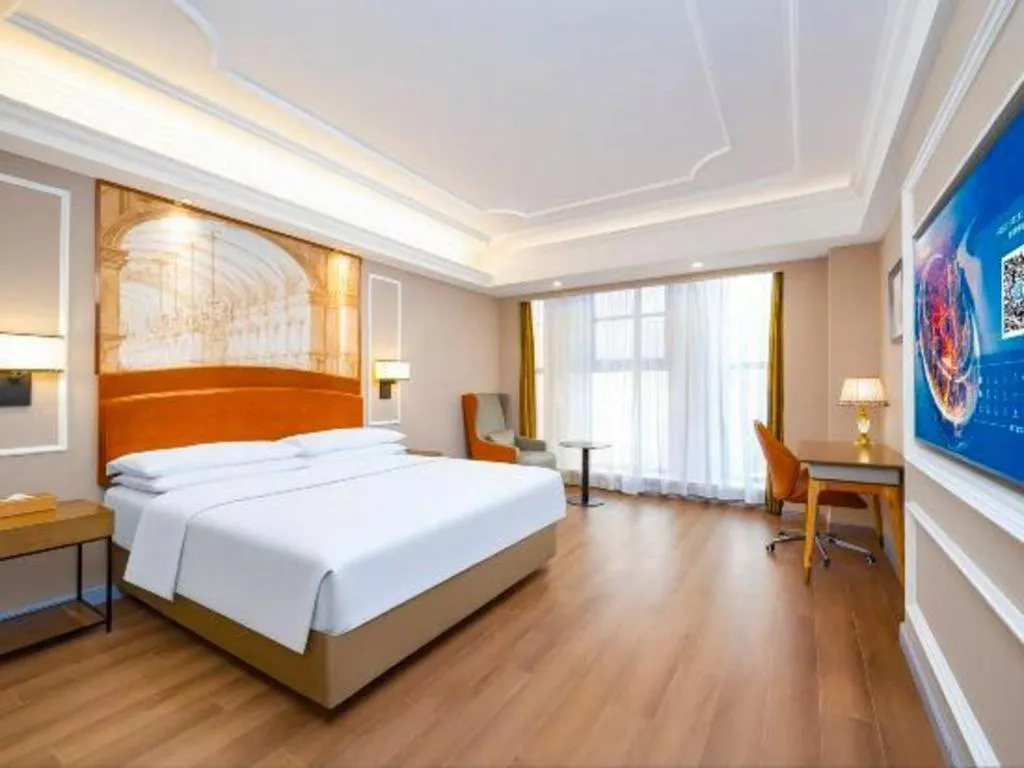 Bed in Vienna International Hotel Kunming Guangfu Road Aegean Shopping Center