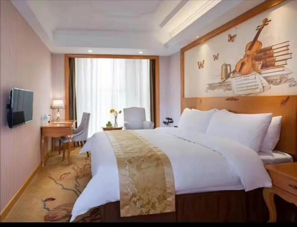 Bed in Vienna International Hotel Kunming Guangfu Road Aegean Shopping Center