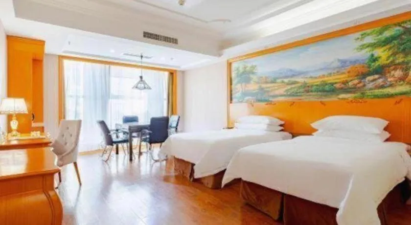 Bed in Vienna International Hotel Kunming Guangfu Road Aegean Shopping Center